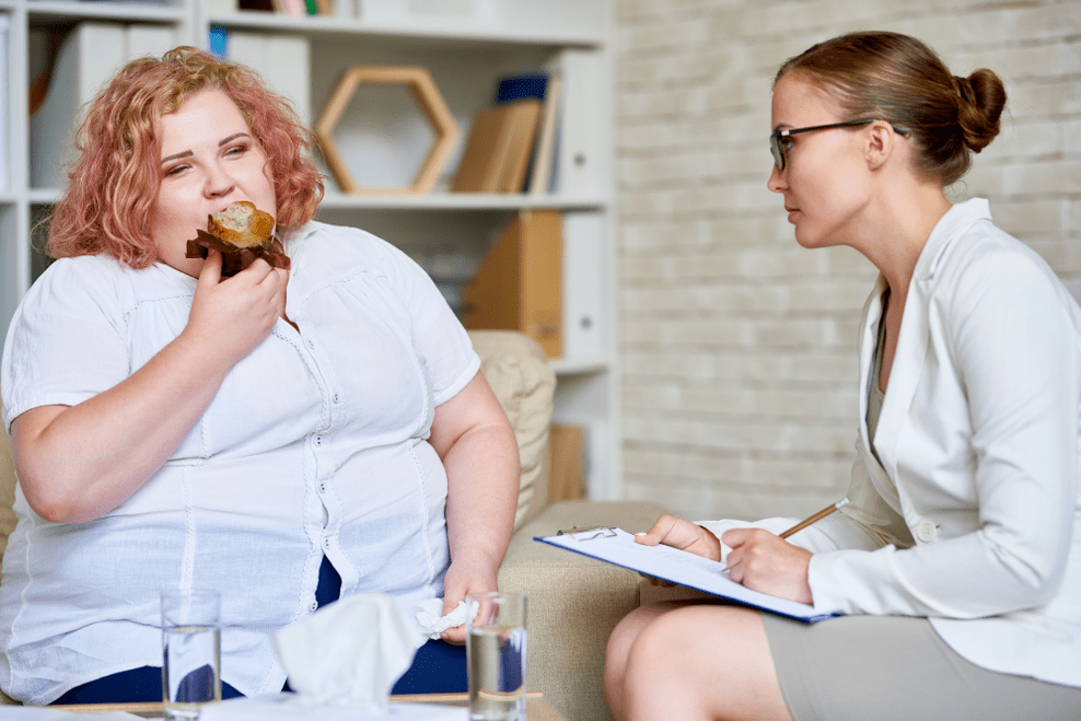 Femeie supraponderală la o întâlnire de specialitate
